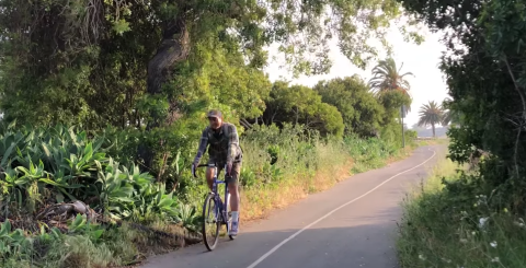 biker commuting to UCSB campus